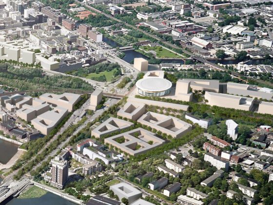 Luftaufnahme: Rundes Stadion mit umliegenden Gebäuden im Stadtgebiet.