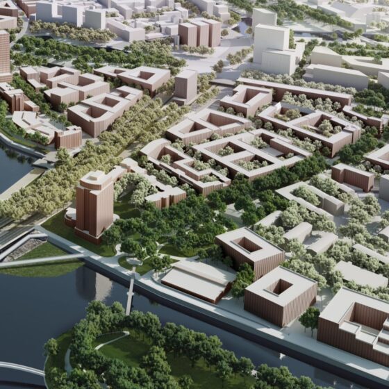 Vogelperspektive zeigt dichte Bebauung und klare urbane Struktur der Stadt.