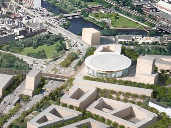 Luftaufnahme: Rundes Stadion mit umliegenden Gebäuden im Stadtgebiet.