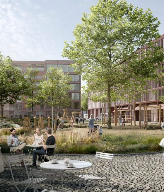 Nachbarschaftsgarten mit Sitzplätzen und umgeben von Gebäuden und Cafés.